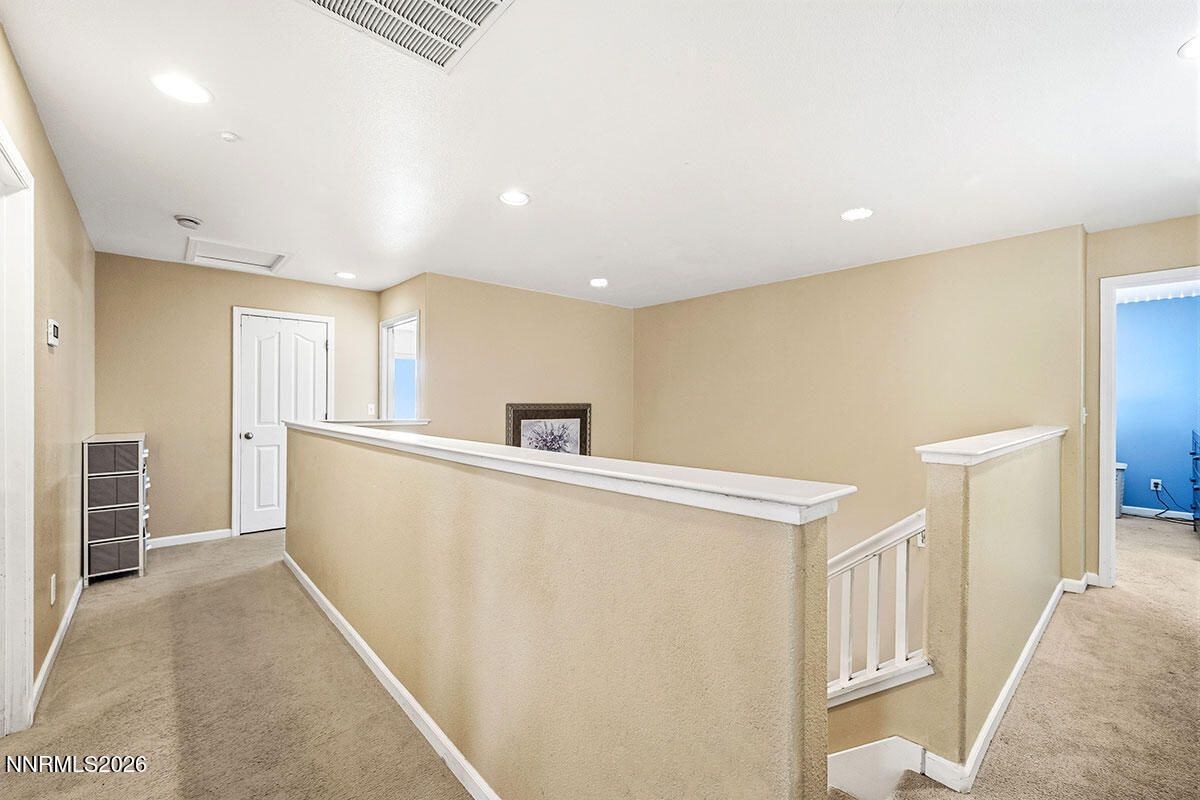 11365 Torino Way Reno, NV 89521 - Photo 19 of 29 a view of hallway with furniture and wooden floor