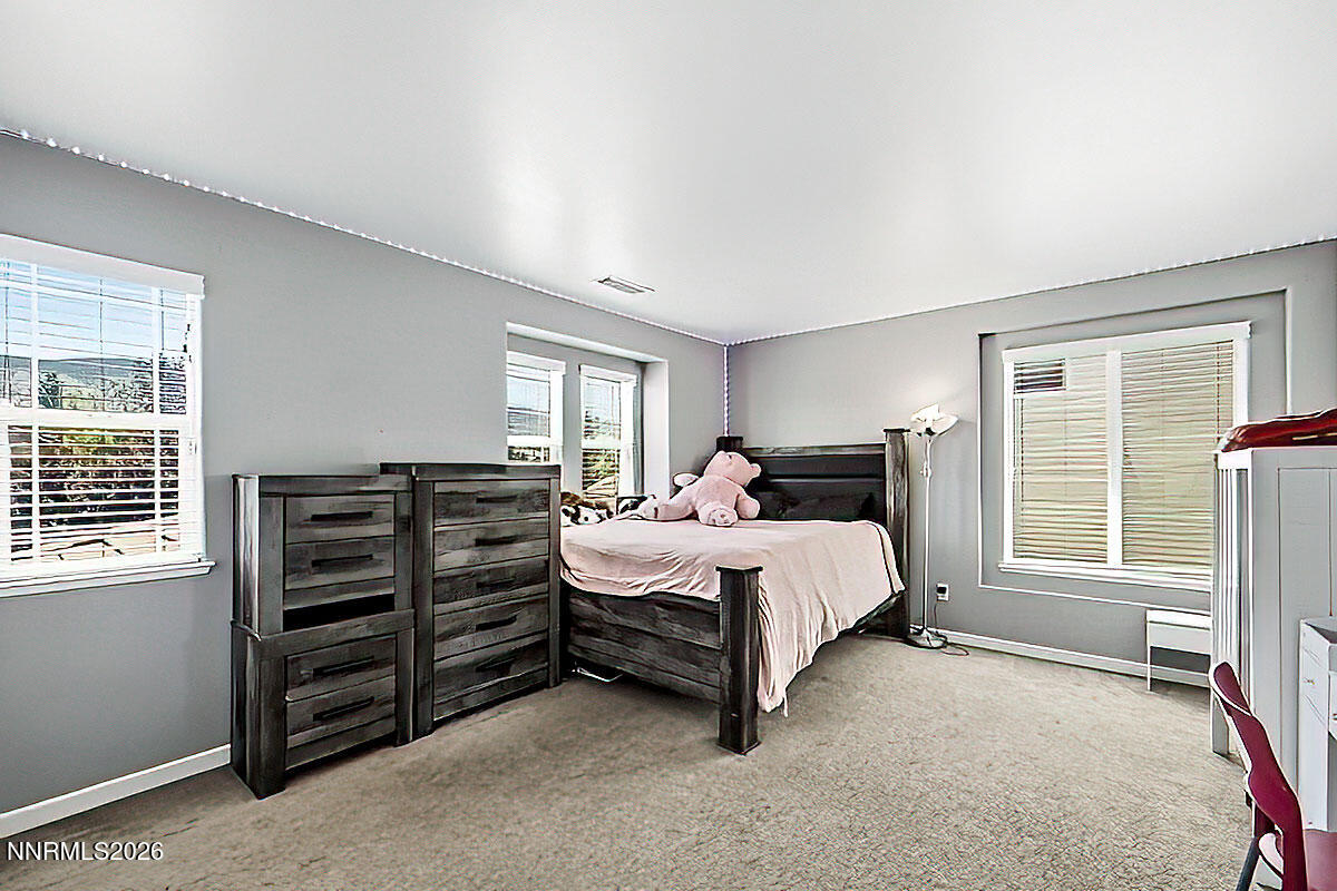 11365 Torino Way Reno, NV 89521 - Photo 20 of 29 a bedroom with a bed and a tv