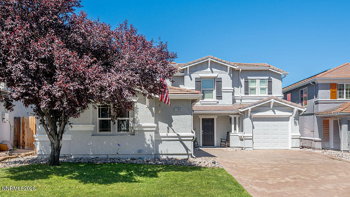 11365 Torino Way Reno, NV 89521 - Photo 2 of 29 a front view of a house with a garden and trees