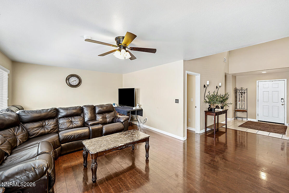 11365 Torino Way Reno, NV 89521 - Photo 4 of 29 a living room with furniture and a wooden floor