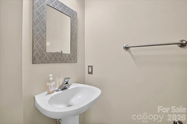 a bathroom with a sink and mirror