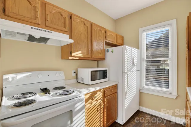 a kitchen with stainless steel appliances a refrigerator and a stove