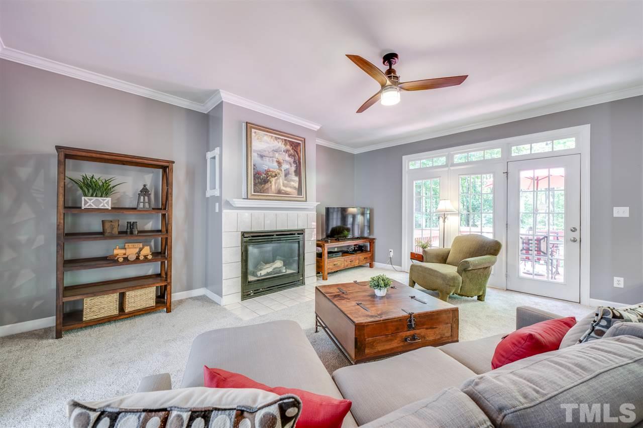 11921 Larka Court Raleigh, NC 27613 - Photo 3 of 30 a living room with furniture and a fireplace