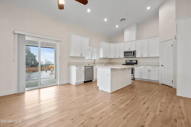 a view of kitchen with wooden floor