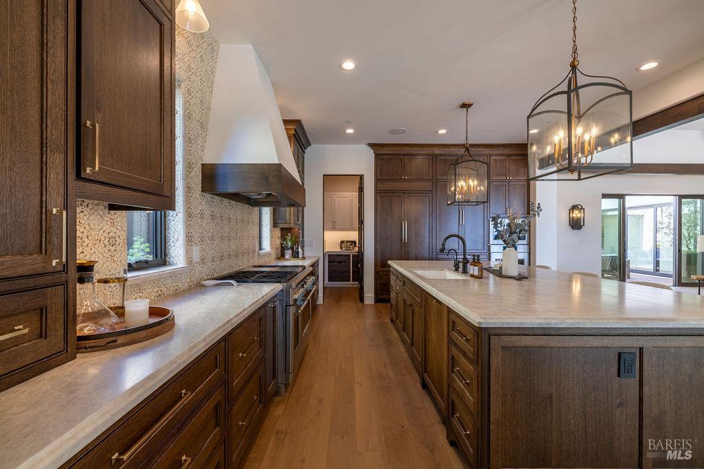 3981 Parker Hill Road Santa Rosa, CA 95404 - Photo 12 of 43 a kitchen with stainless steel appliances granite countertop a sink a stove and a refrigerator