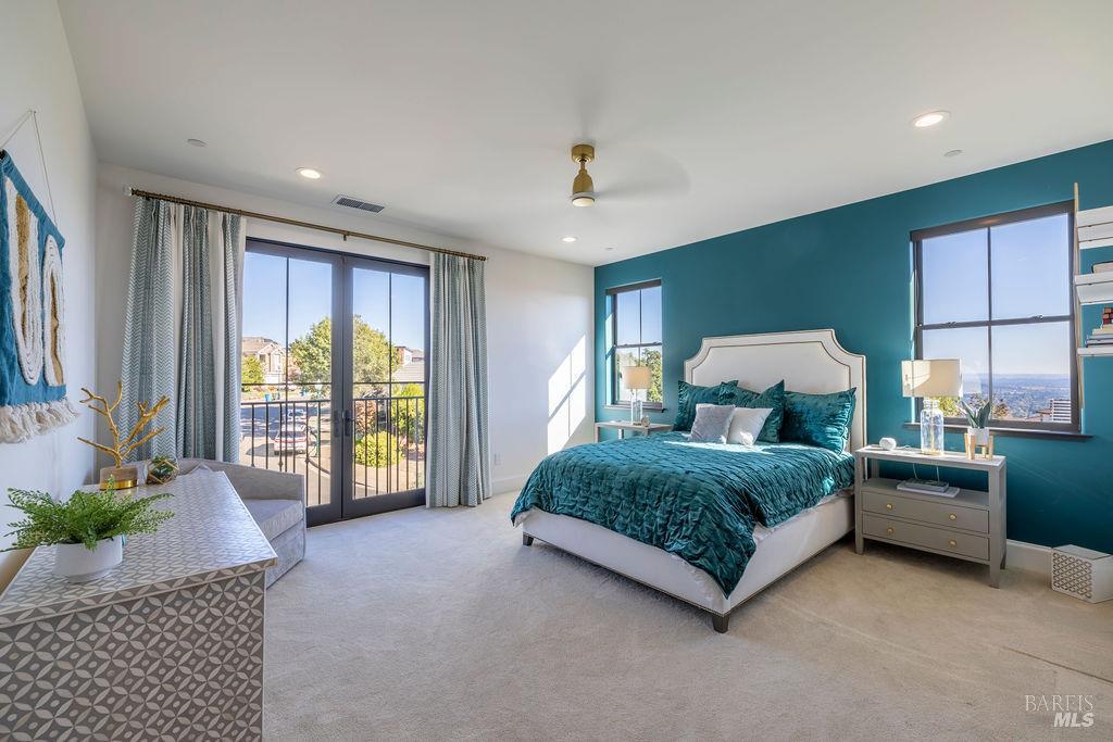 3981 Parker Hill Road Santa Rosa, CA 95404 - Photo 25 of 43 a spacious bedroom with a large bed and windows