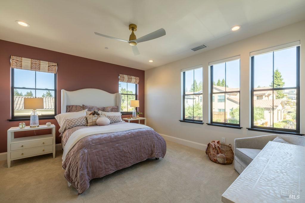 3981 Parker Hill Road Santa Rosa, CA 95404 - Photo 27 of 43 a bedroom with a bed and ceiling fan