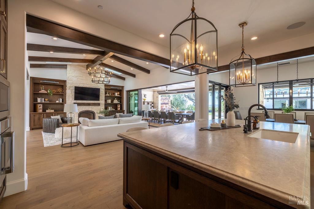 3981 Parker Hill Road Santa Rosa, CA 95404 - Photo 10 of 43 a kitchen with stainless steel appliances granite countertop a sink a stove and a wooden floors