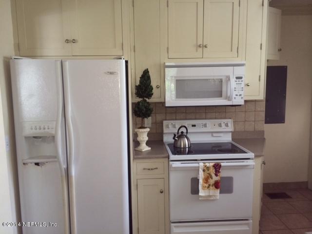 4052 Dover Road Jacksonville, FL 32207 - Photo 9 of 14 a kitchen with appliances and cabinets