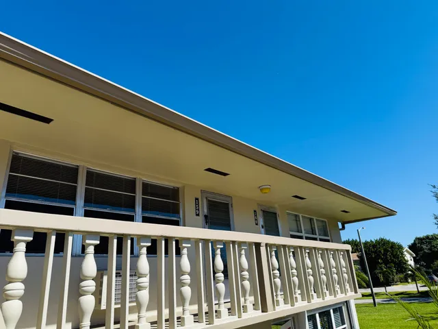 a front view of a house with a deck