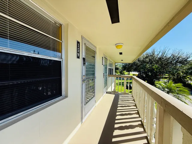 a view of balcony with wooden floor and stairs