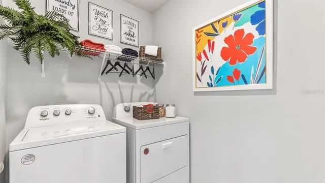 a utility room with dryer and washer