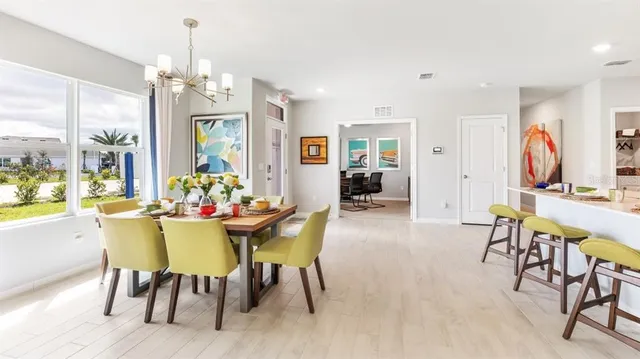 a view of a dining room with furniture window and outside view