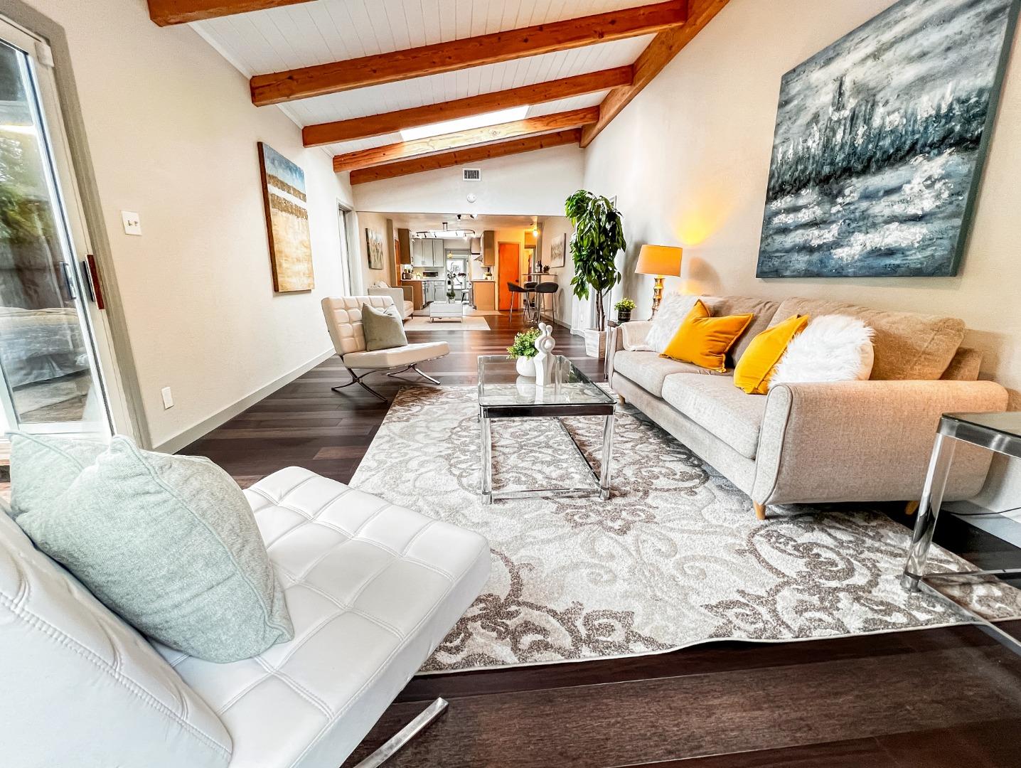 315 King Street Redwood City, CA 94062 - Photo 1 of 1 a living room with furniture and a painting on the wall