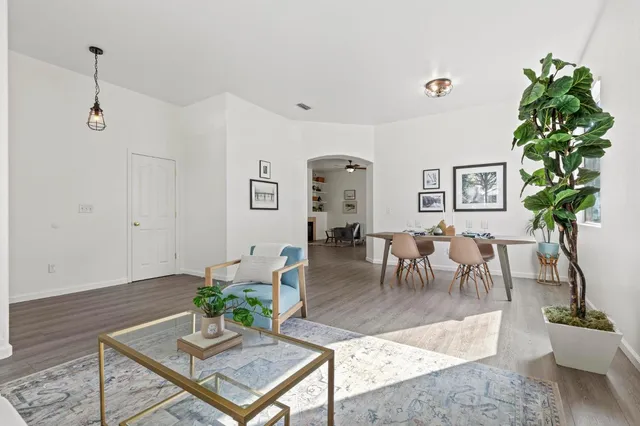 a living room with furniture and a table