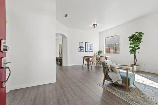 a workspace with furniture window and wooden floor
