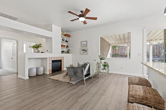 a kitchen with a refrigerator and a white cabinets