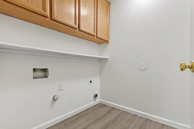 a bathroom with a granite countertop sink mirror vanity and toilet