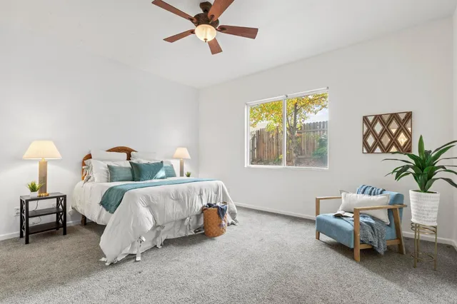 a bedroom with a bed and a couch