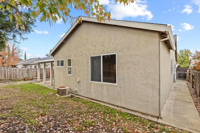 a view of a walk in front of house