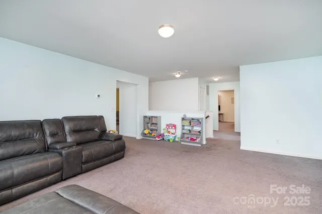 a view of a livingroom with furniture and a couch