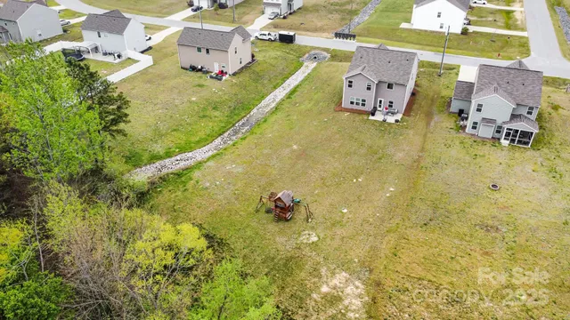 an aerial view of residential house with swimming pool