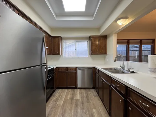 a kitchen with a refrigerator and a sink
