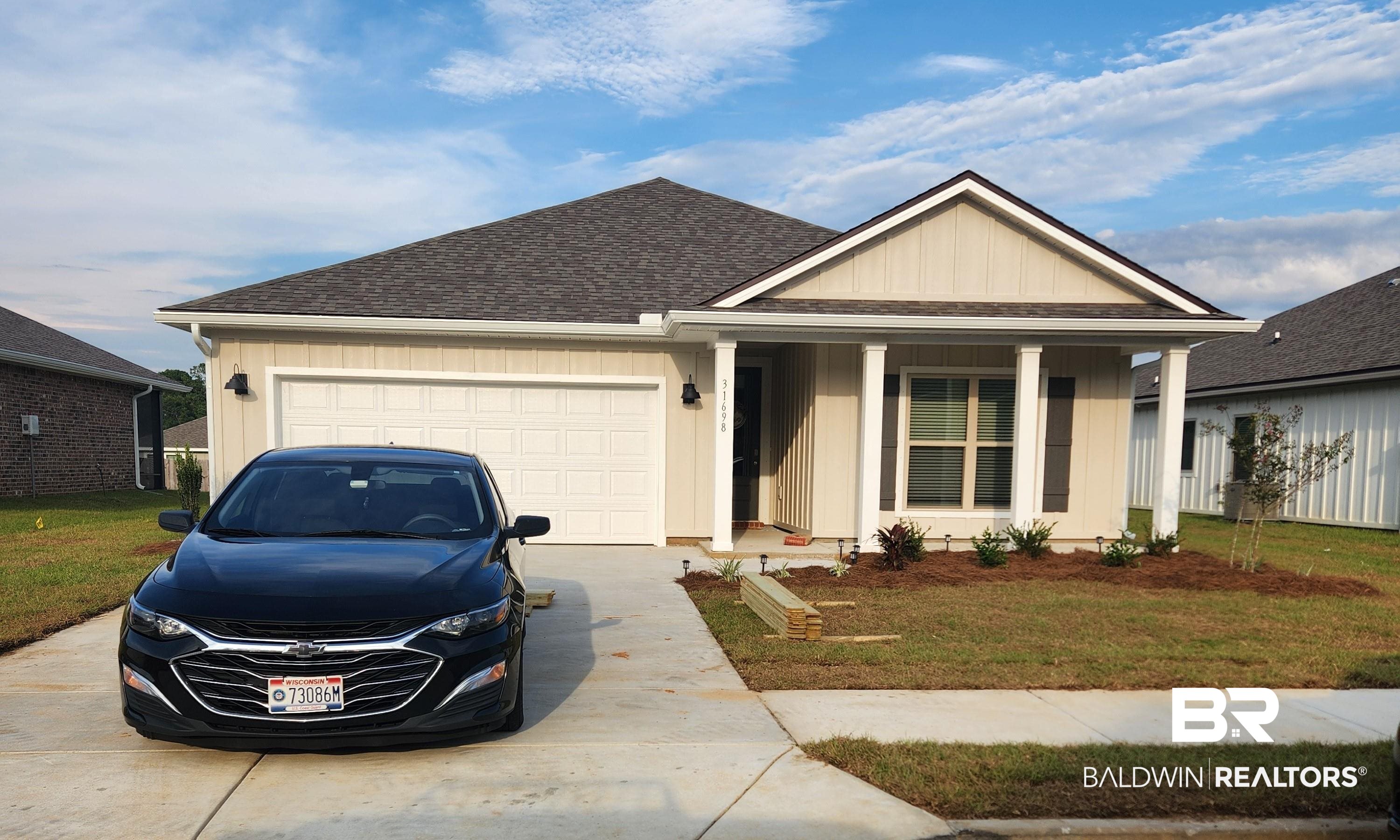 31698 Lyon Road Daphne, AL 36527 - Photo 1 of 42 Single-story residence featuring a covered entry, an attached garage, and a concrete driveway