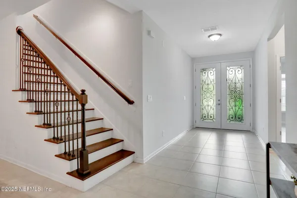 a bedroom with a bed and a table