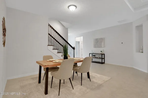 a view of a living room and entry way