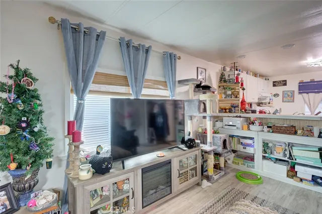 a kitchen that has a lot of cabinets a stove and a window