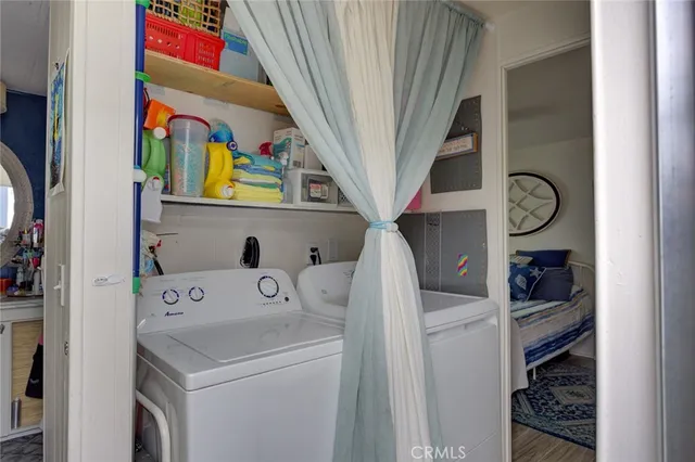 a view of storage and utility room with washer and dryer