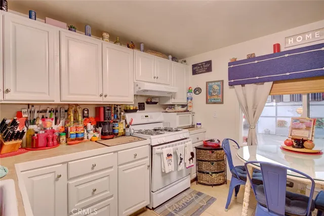 a view of a kitchen with appliances and cabinets