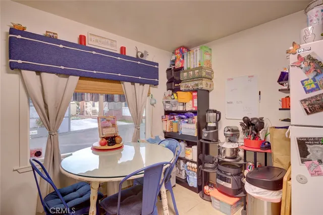 a very nice looking dining room with a table and chairs in it