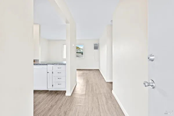 a view of a bedroom from the hallway