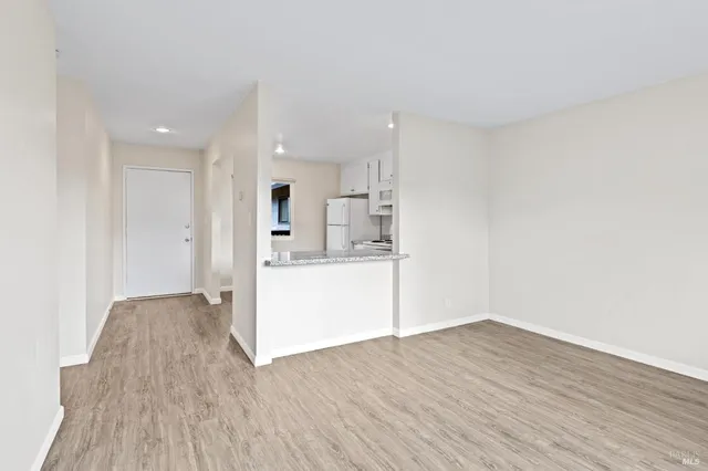 a view of kitchen with wooden floor and window
