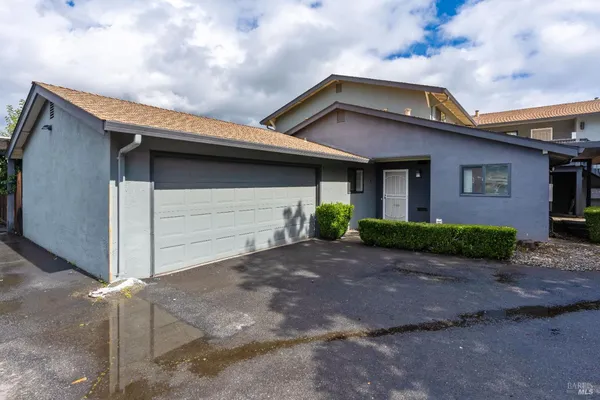 a front view of a house with garage