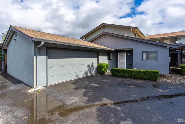 a front view of a house with garage
