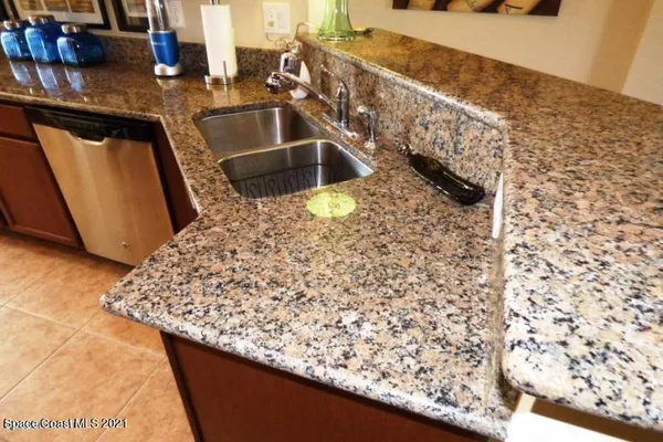 a kitchen with a sink and a stove