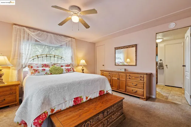 a bedroom with a bed and a dresser