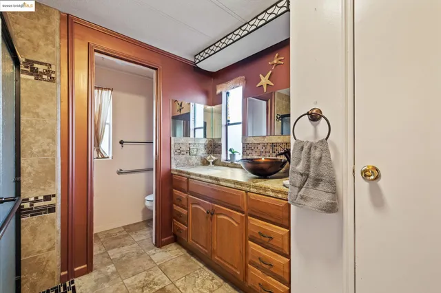 a kitchen with a refrigerator and cabinets