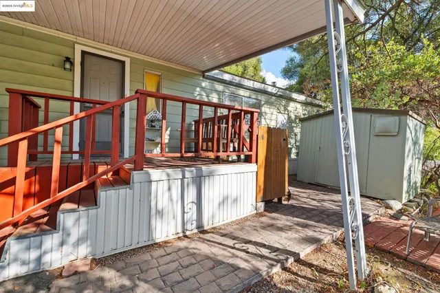 a view of small house with wooden floor