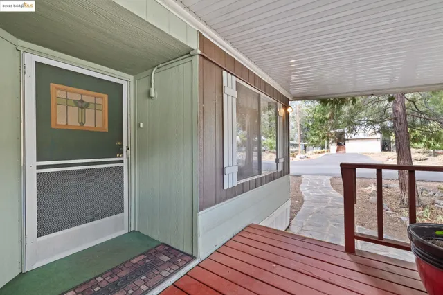 a view of a balcony with wooden floor