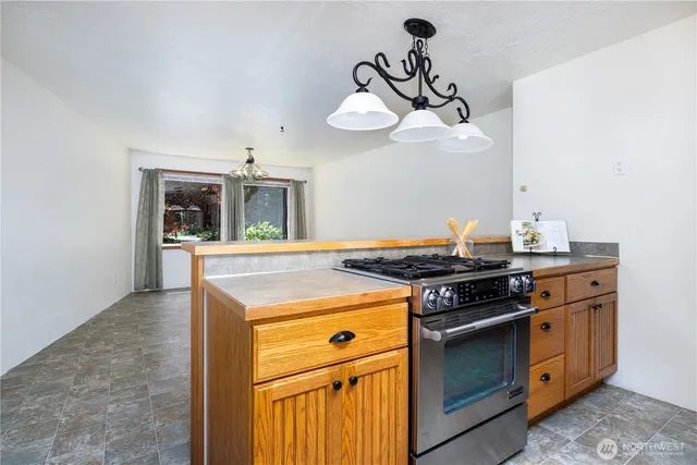 a kitchen with a stove and a sink