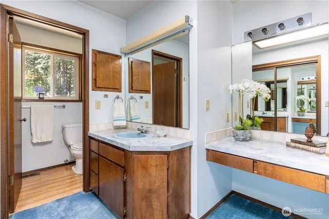 a bathroom with a glass shower door