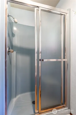 a utility room with cabinets washer and dryer