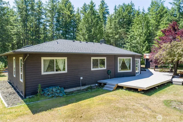 a aerial view of a house with swimming pool and porch