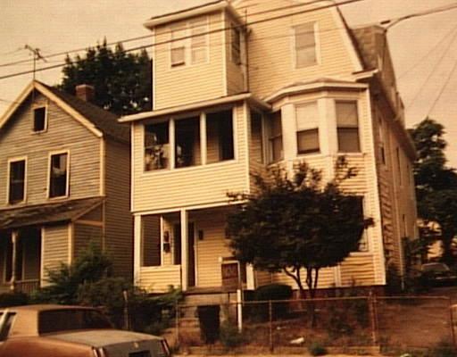 173-75 5th Street Bridgeport, CT 06607 - Photo 1 of 1 a front view of a house with street