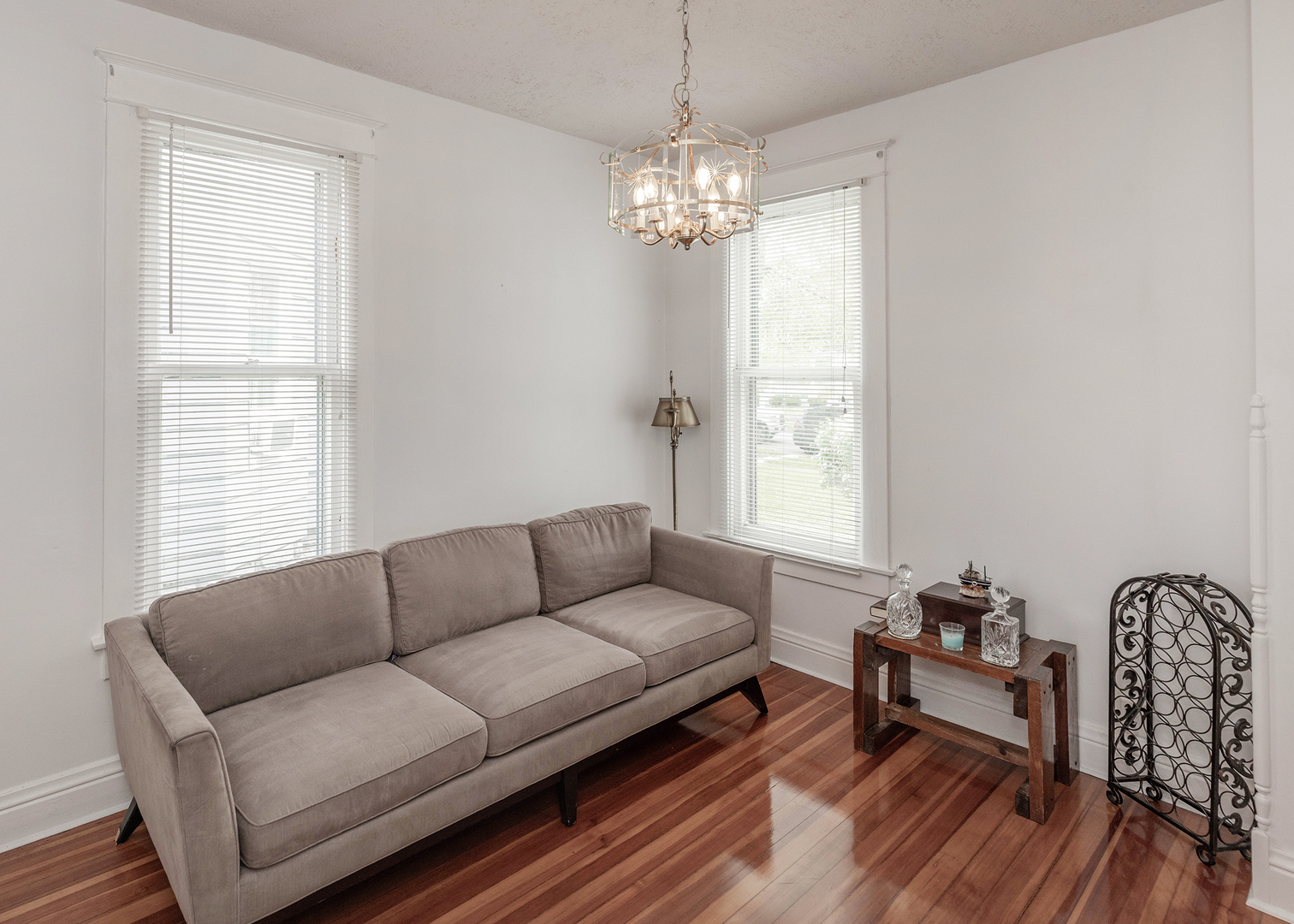 1839 15th Street Moline, IL 61265 - Photo 16 of 32 a living room with furniture a window and a chandelier