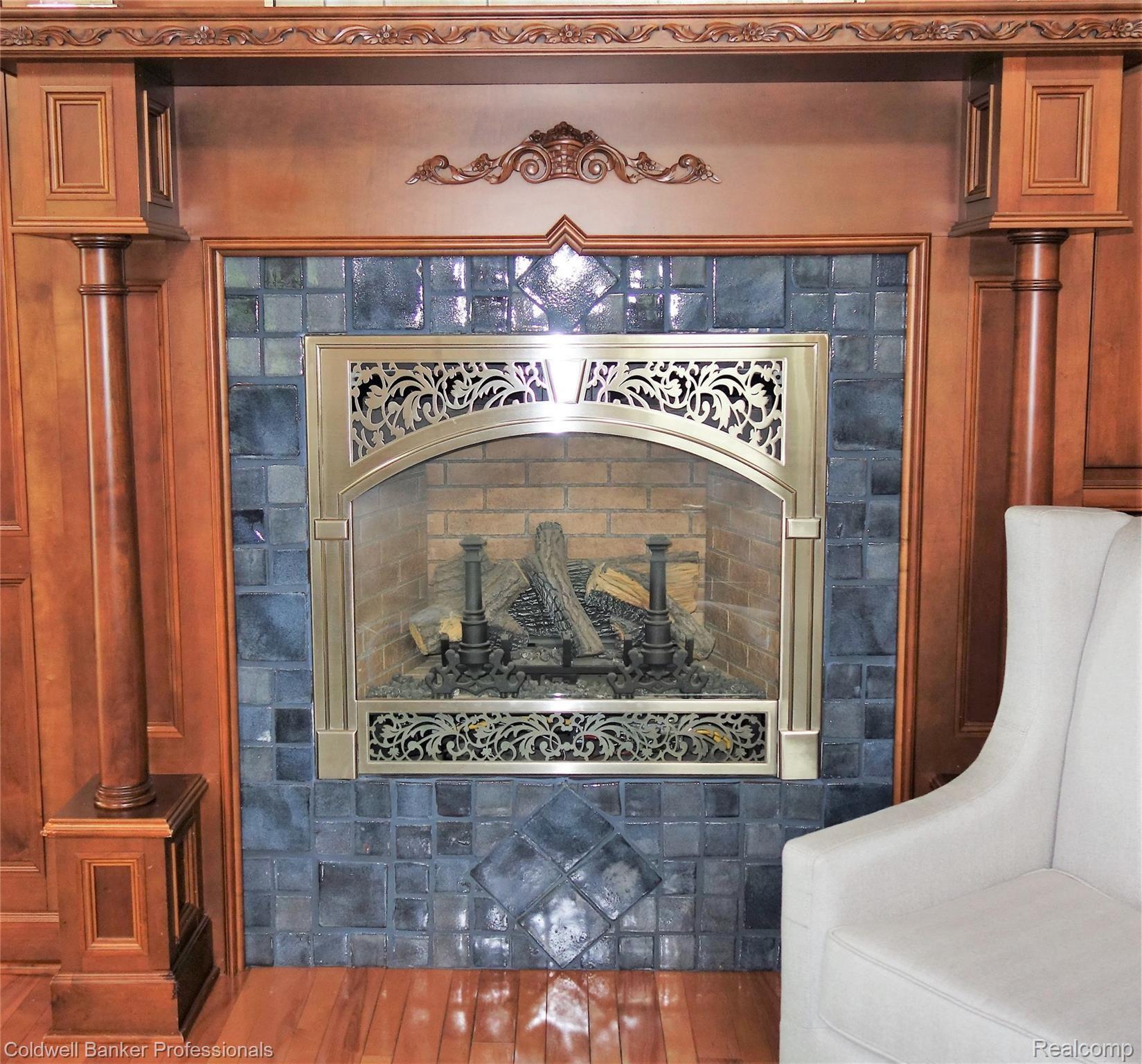 7755 Holcomb Road Clarkston, MI 48348 - Photo 6 of 51 Pewabic Tile surrounds 1 of 5 fireplaces